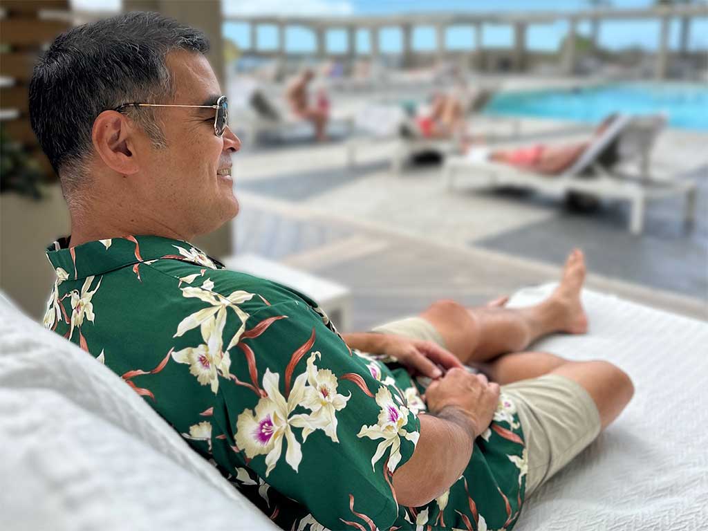 Star Orchid green Hawaiian shirt at the pool