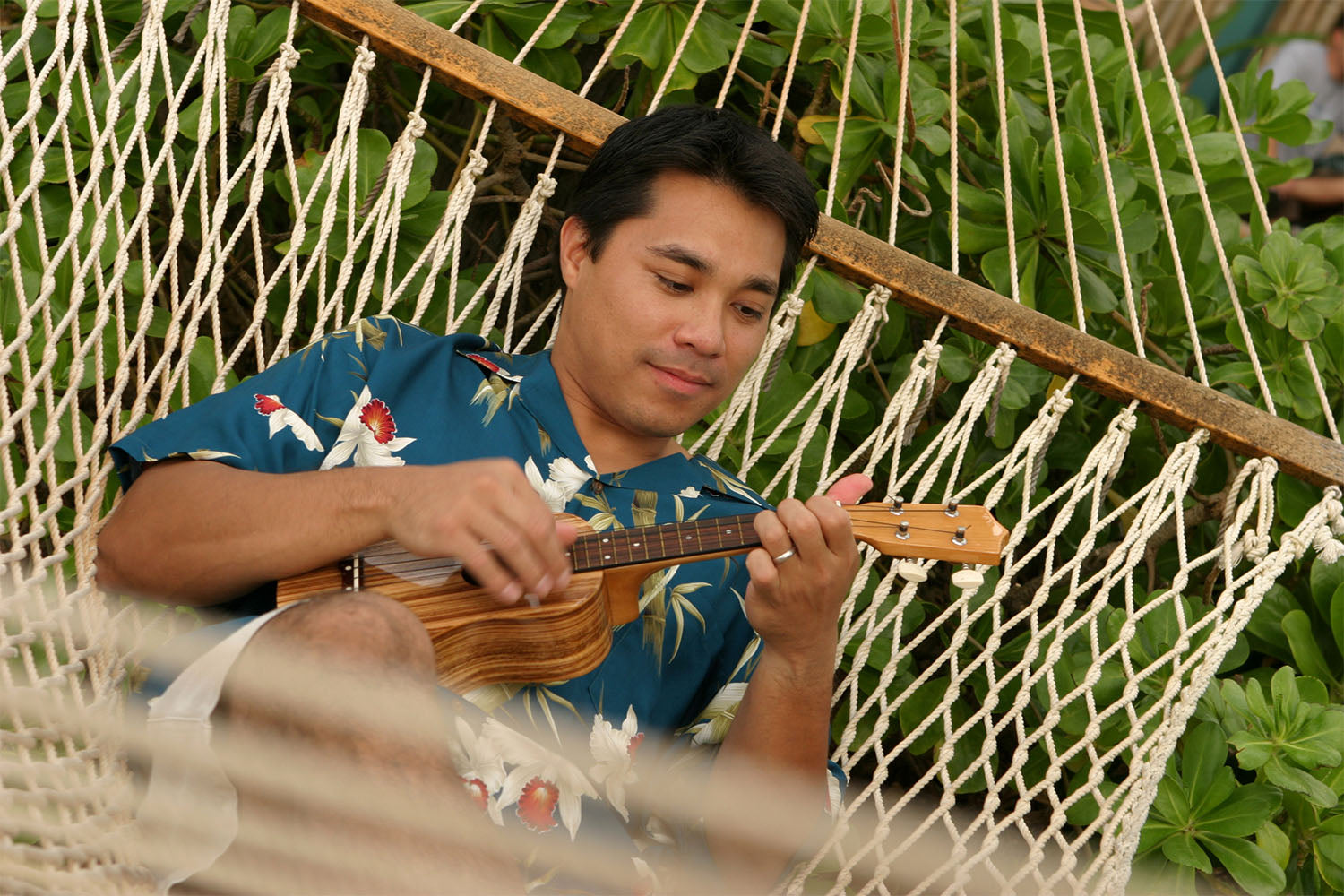 relaxing in an Aloha shirt with an ukulele