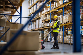 Worker preparing an order at Ulti-MATE garage warehouse in California