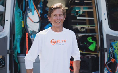 male smiling with an Elite Watersports shirt on