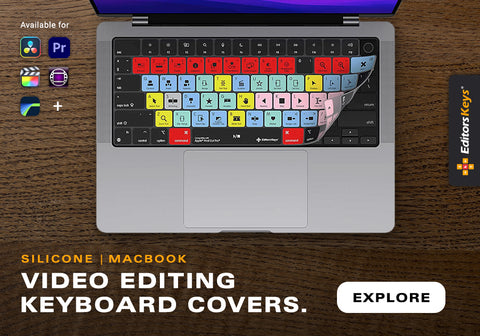 MacBook Pro on desk with Editors Keys video editing shortcut cover on the keyboard