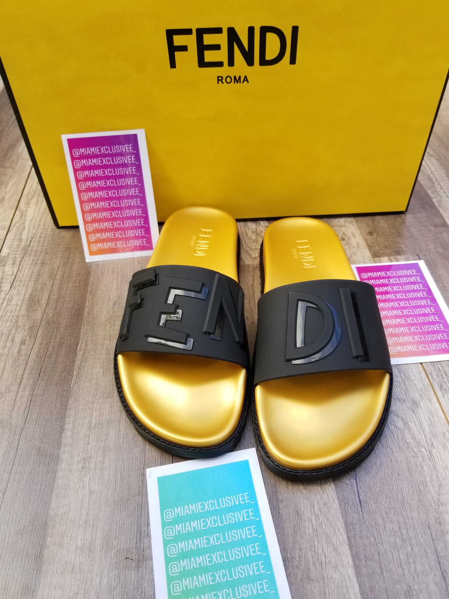 black and gold fendi slides