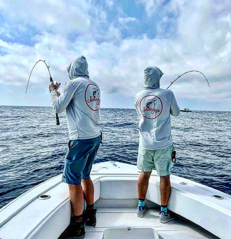 2 Anglers Slow Pitch Jigging the Bow of a Center Console boat