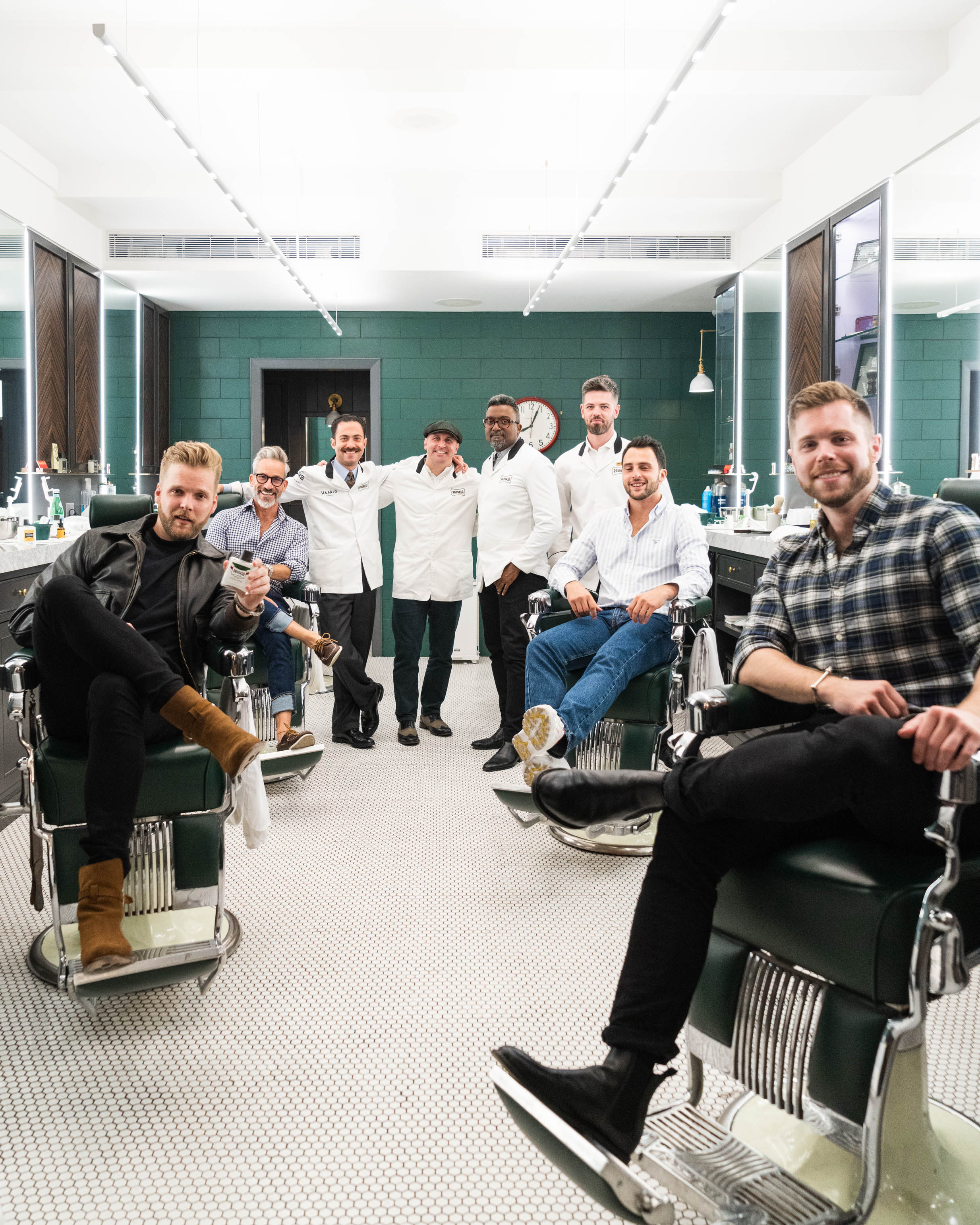 Image of 8 men getting ready for their Proraso class sitting in barber chairs at Haar & Co. Barbershop in New York City