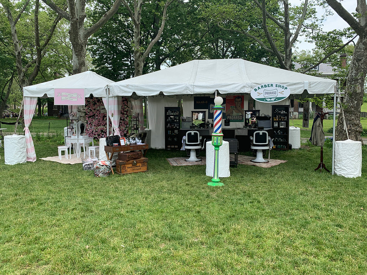 Atmosphere of Proarso outdoor barbershop set up for Jazz Age Lawn Fest