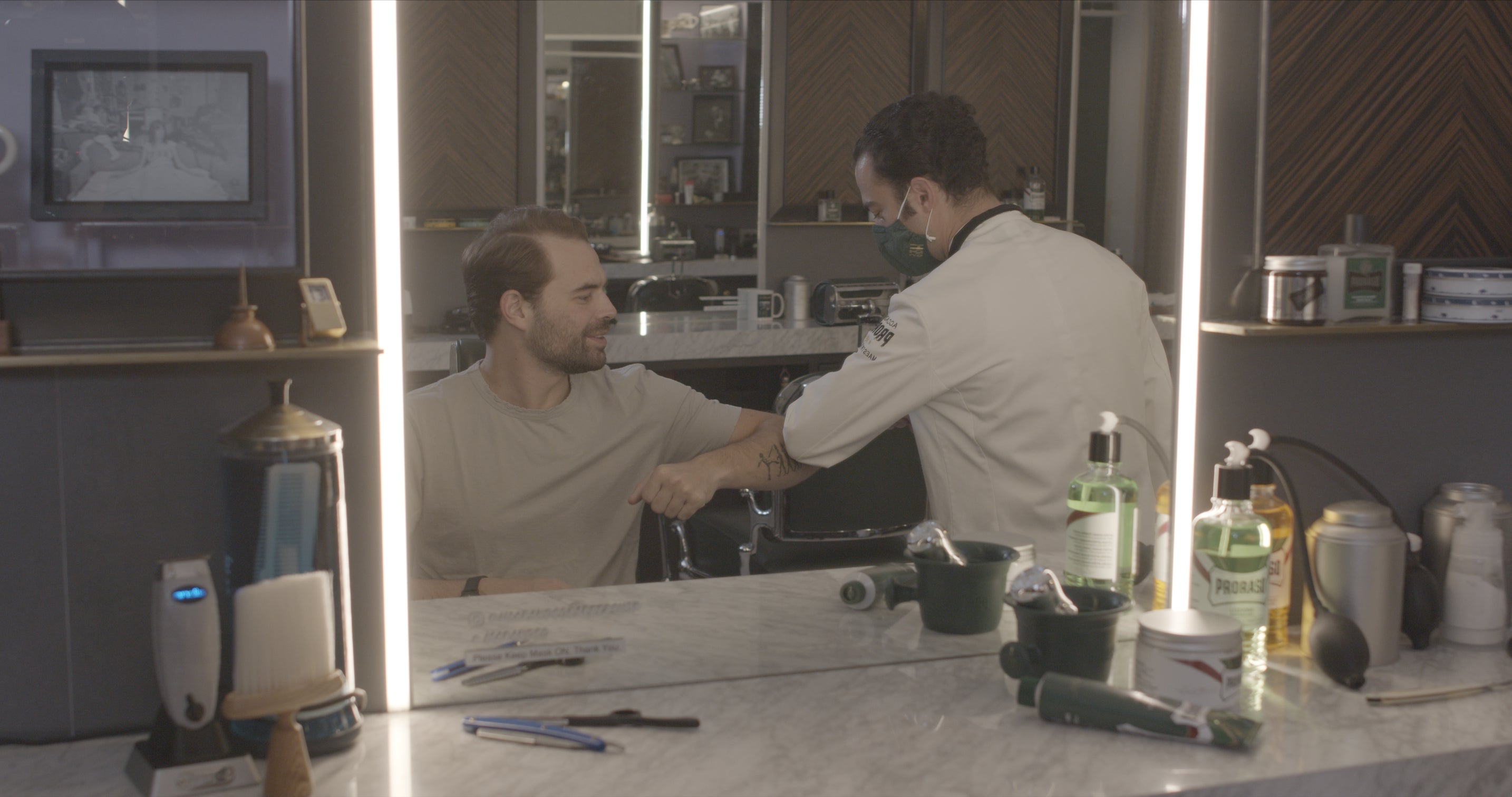 Mike and Alec greeting one another at Haar & co Barbershop