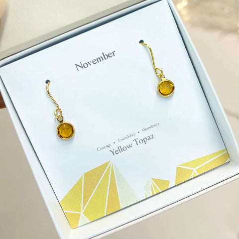 Image shows november birthstone drop earrings in a white gift box