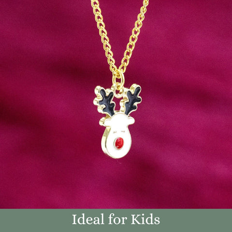 Image shows a novelty Rudolph the reindeer enamel necklace in front of a maroon backdrop