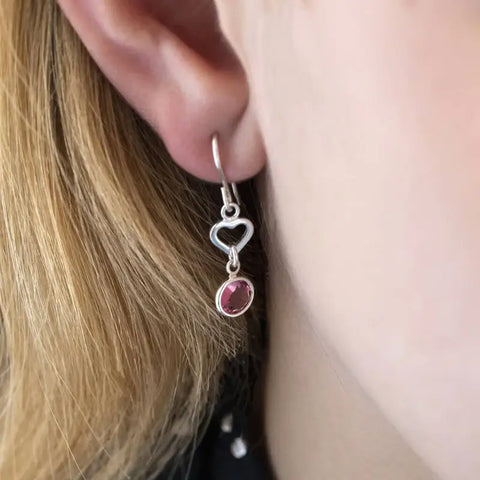 Image shows sterling silver heart birthstone earrings with a rose October birthstone.