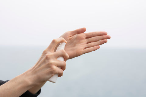 hand with sanitizer