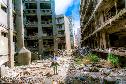 school girl walks over collapsed buildings