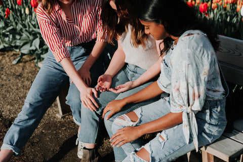 three girls siting together 