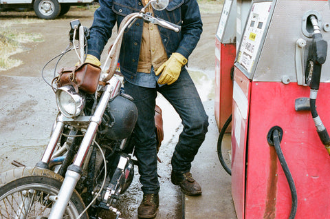 Made in USA Selvedge denim jeans on man at gas pump