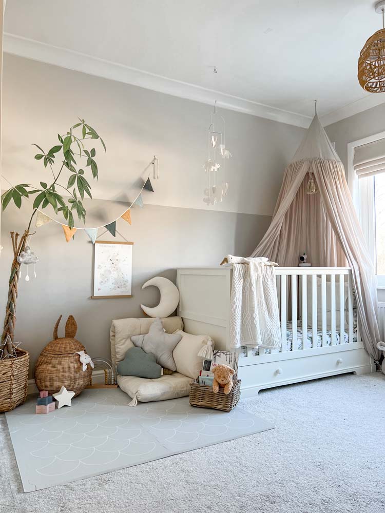 Cot pushed to one side to create play area