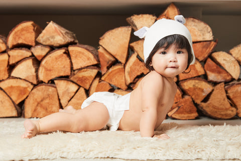 Baby in Kit & Kin Nappy and Bunny Hat