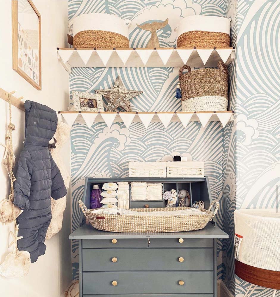 Nautical nursery with wave wallpaper