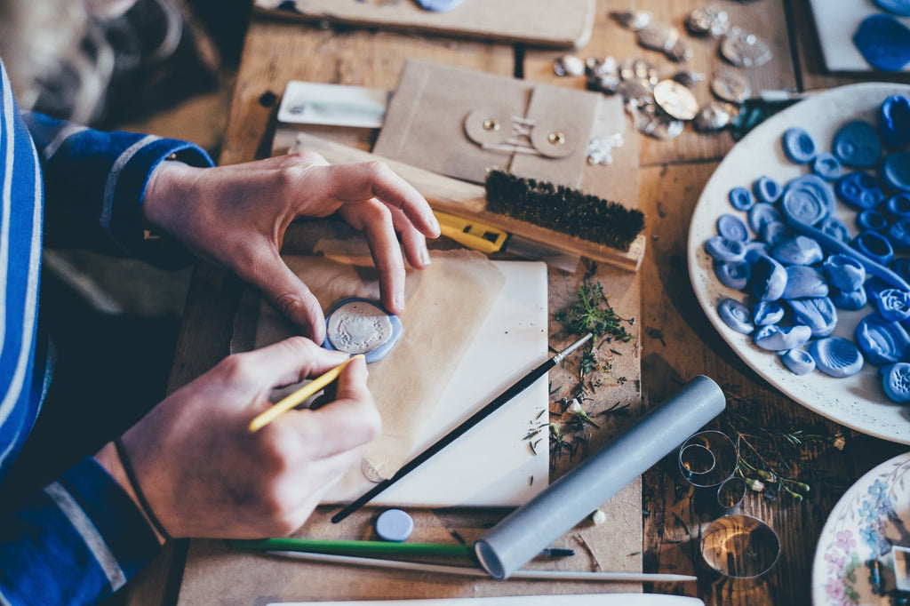 Woman making crafts to sell.