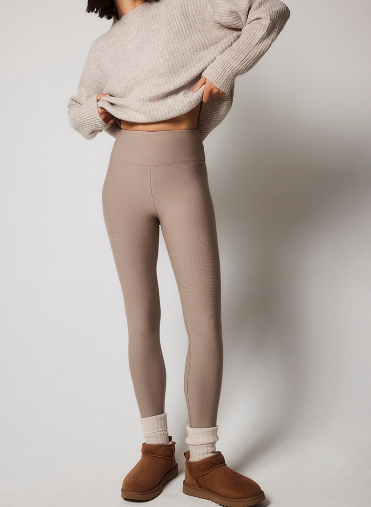 Model stands on white background wearing the Everyday Winter Leggings in Stone