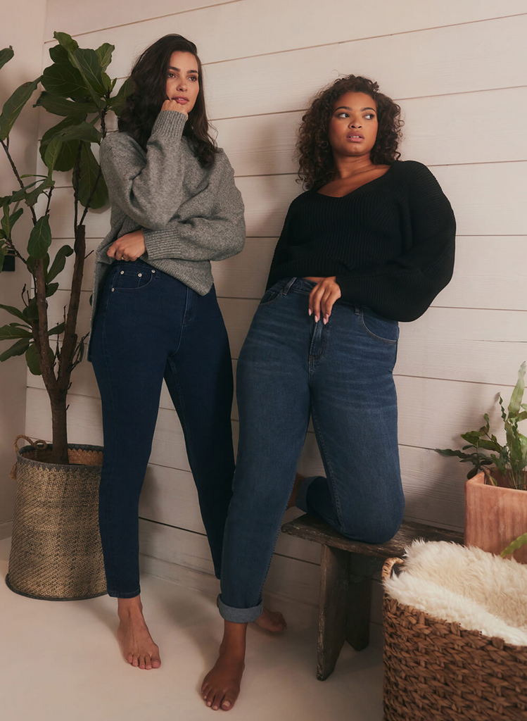 Two women wear LOVALL Mom Jeans in Dark and Mid Blue.