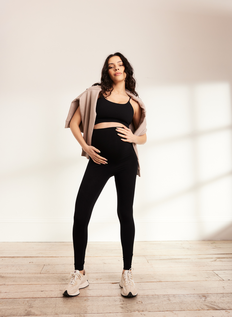 Model wears Black Maternity Lightweight Leggings with a black crop top and the Beige Sweatshirt.
