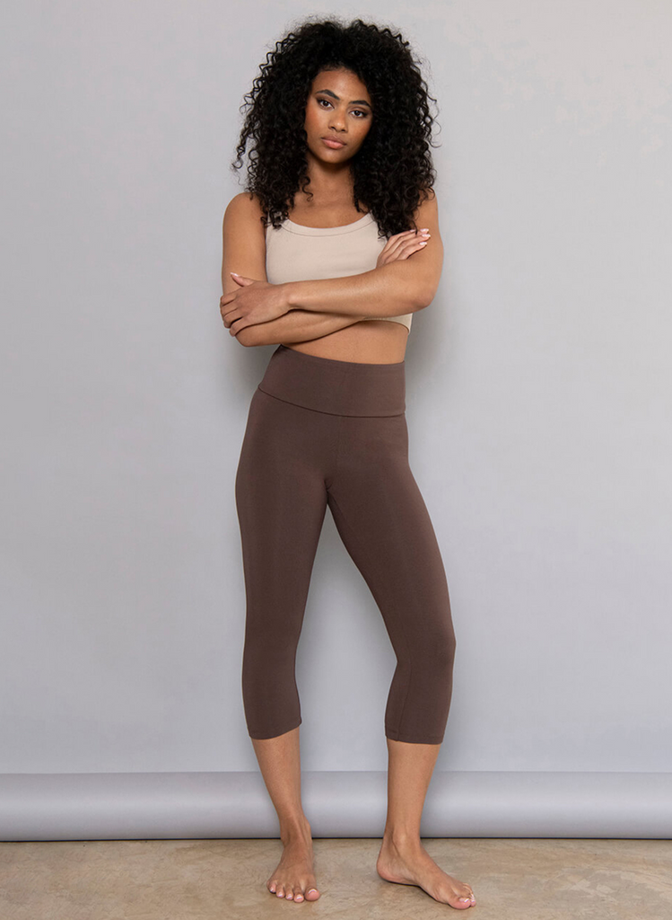 Model wears the Espresso Brown Cropped Leggings with a beige crop top.