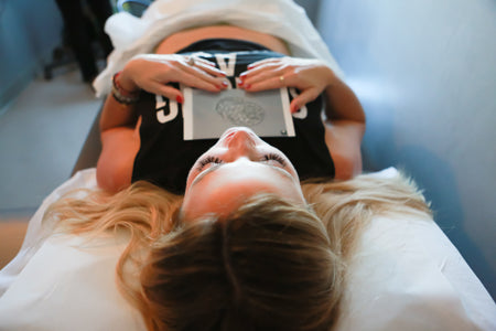 woman laying down after IVF egg transfer