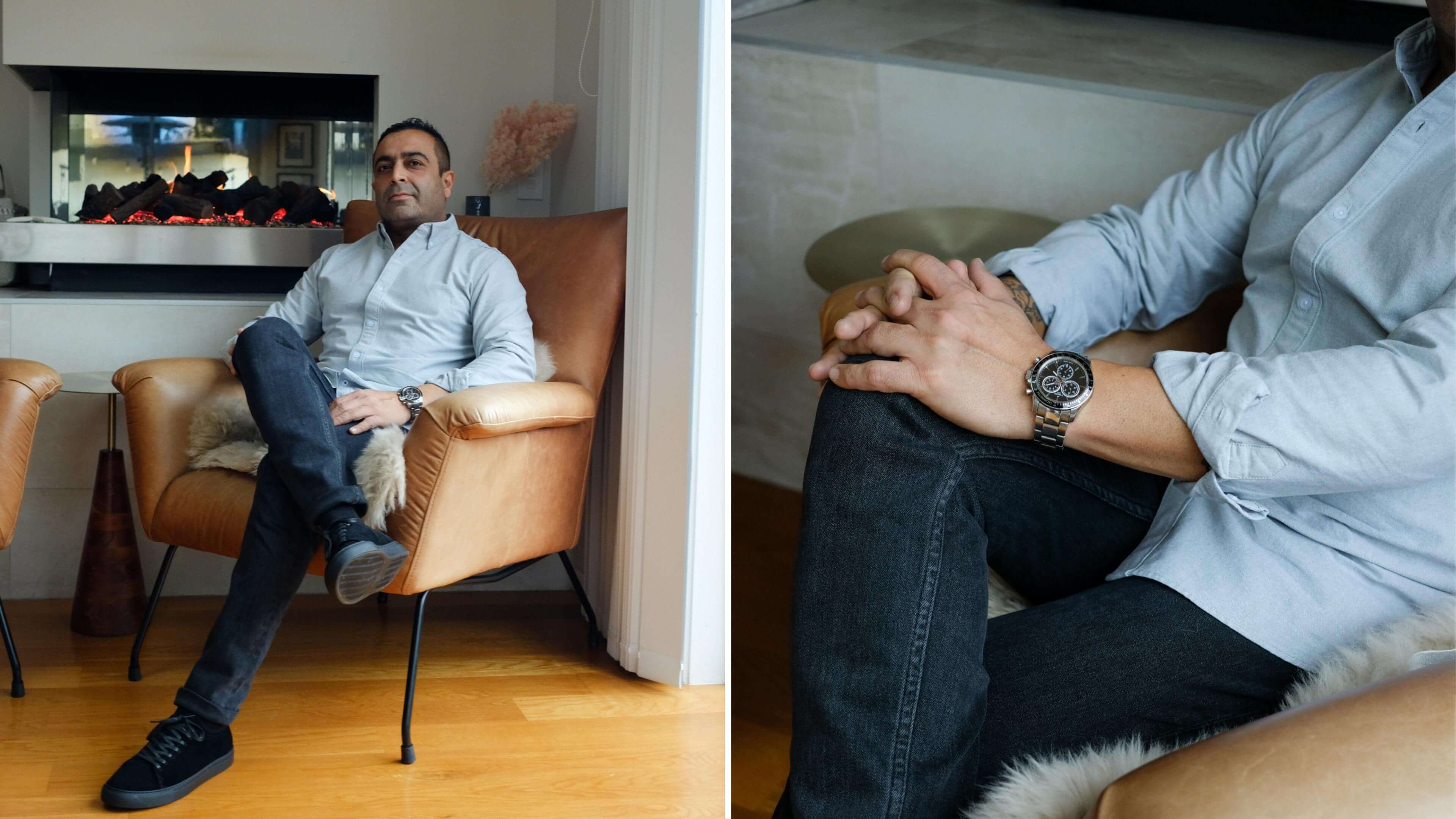 Sid Sahrawat sitting on his couch in front of the fire wearing an Oxford Shirt and Black Jeans from Asuwere