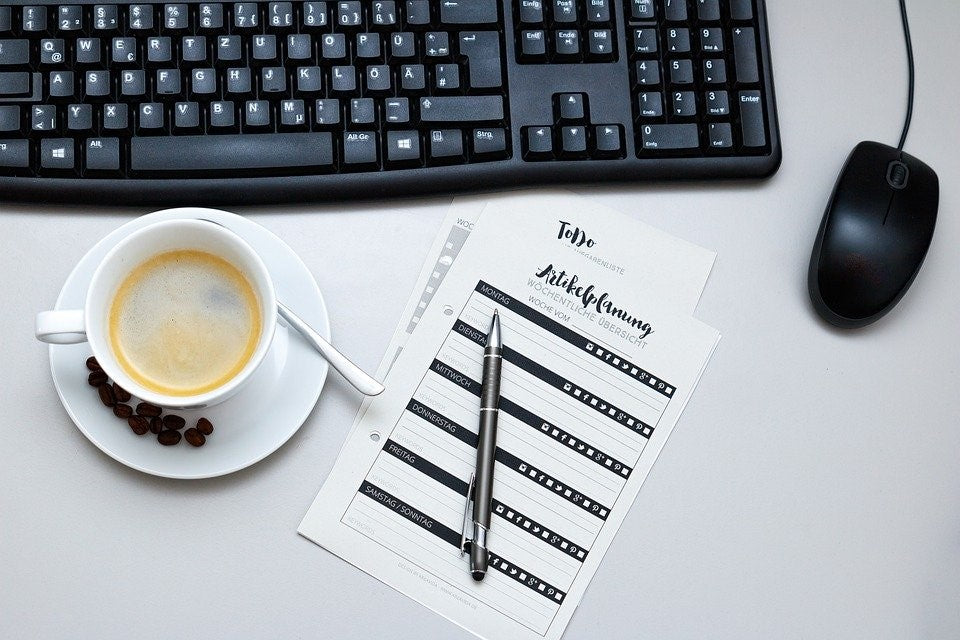 coffee next to a keyboard