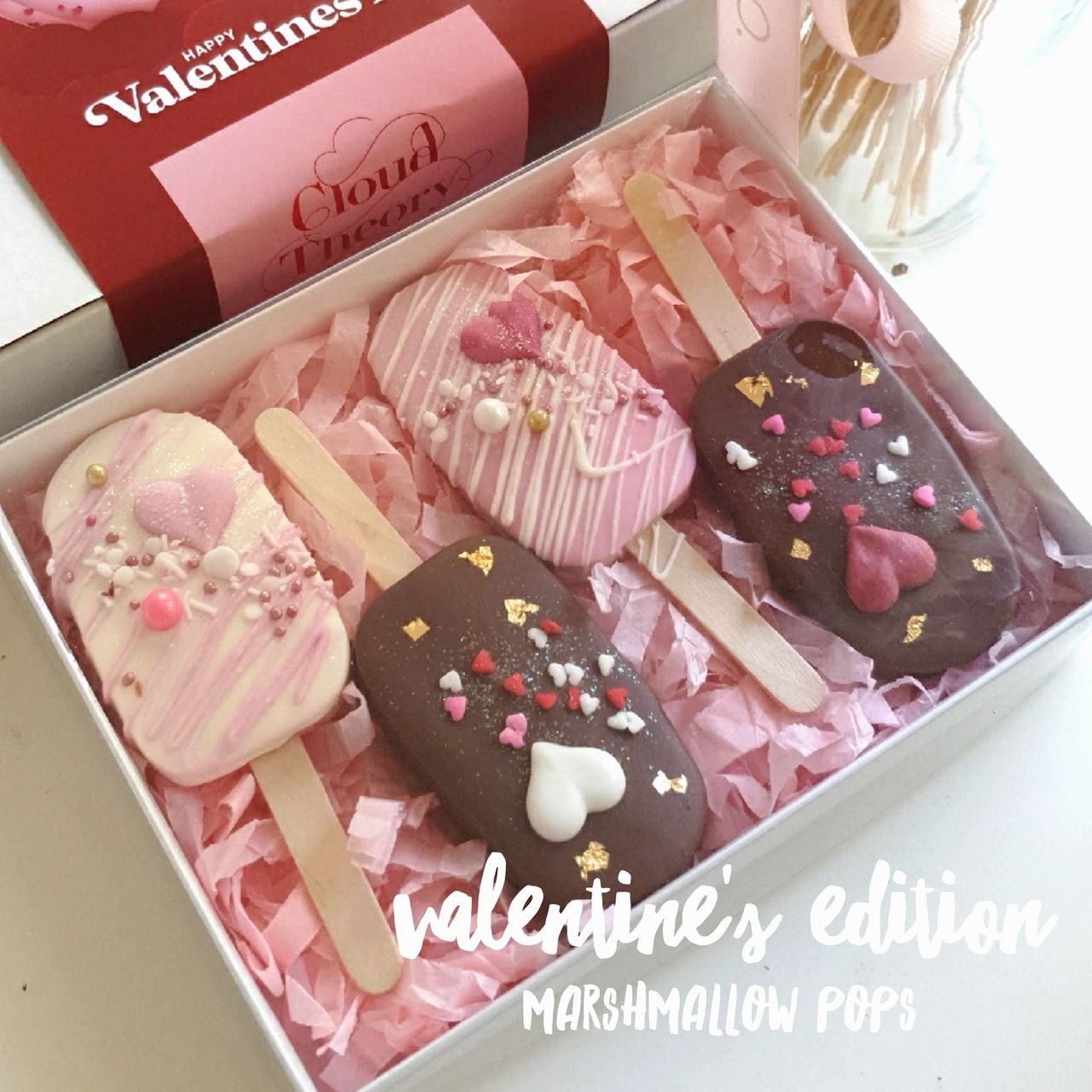 Valentine's Day Edition Marshmallow Popsicles -Take your Valentine to Cloud 9 with these dreamy marshmallow popsicles.  Each marshmallow pop is beautifully decorated and dipped in white chocolate and milk chocolate. 