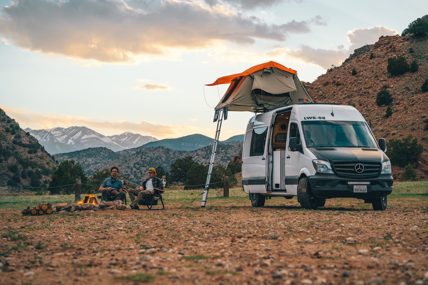 Two guys camping with Parkit chairs and a converted mercedes sprinter van