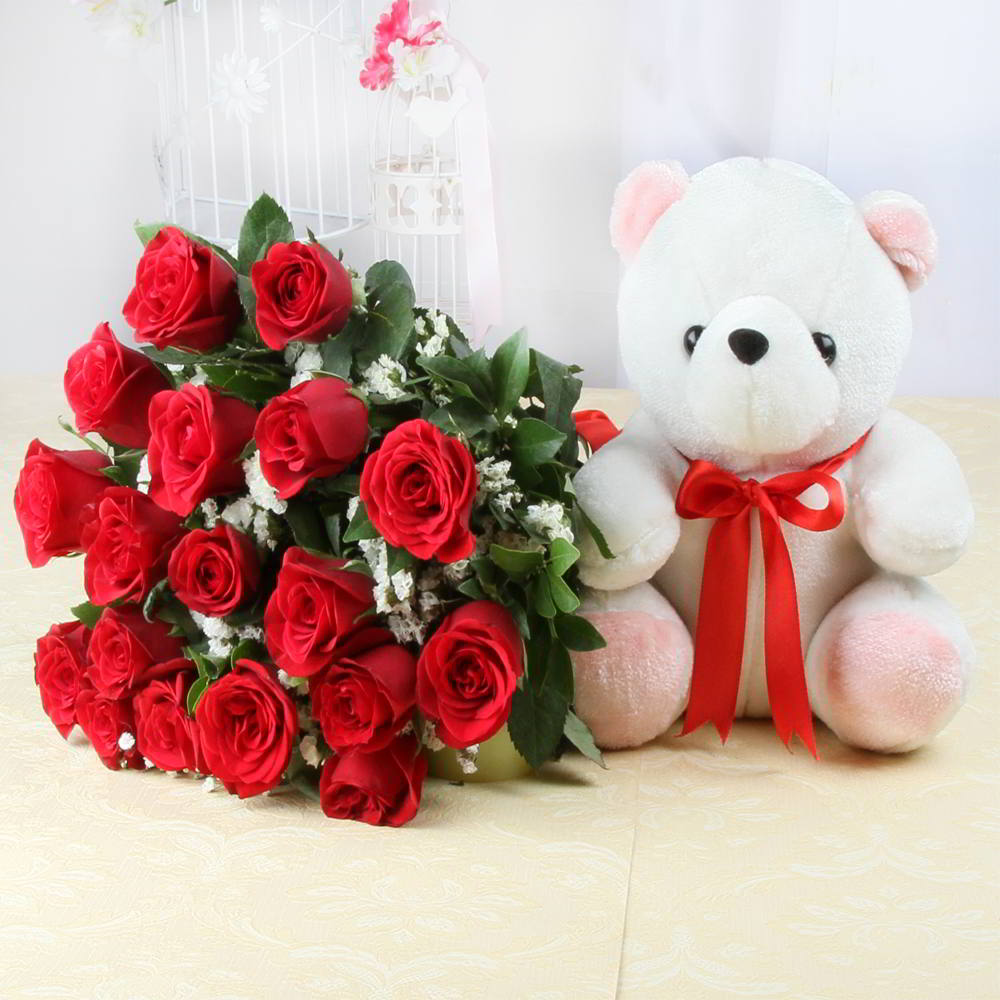 cute teddy bear with red roses