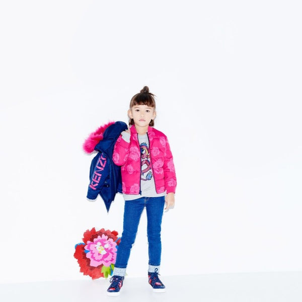 little girl with blue skinny jeans by kenzo - designer kids clothing