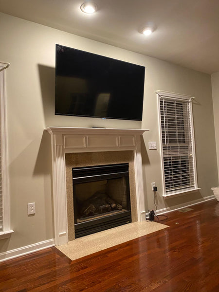 tv mount above fireplace