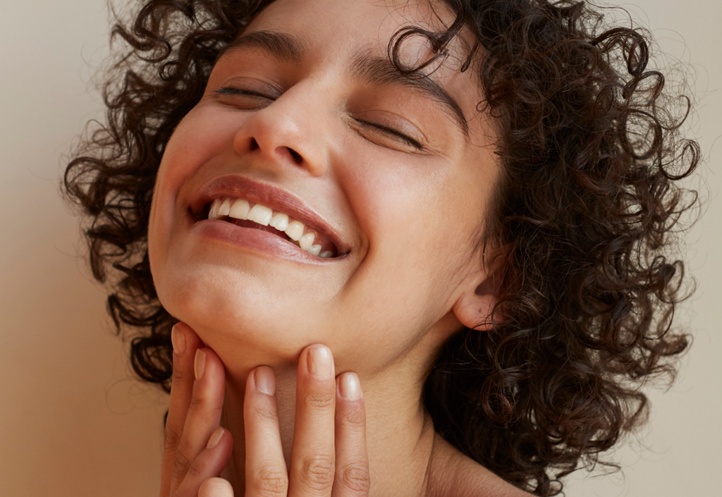 Model Smiling Post Curly Hair Routine