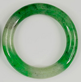 Left: a green hydrogrossular bracelet with clear and green patches