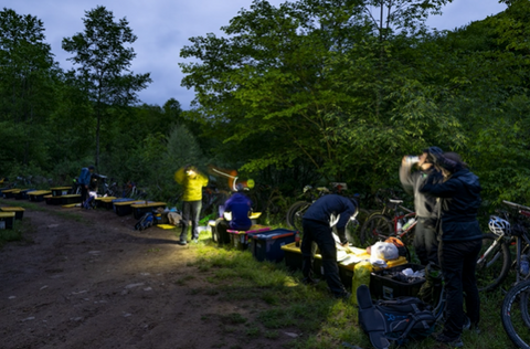 Adventure Racers stop at twilight to hydrate and adjust. 