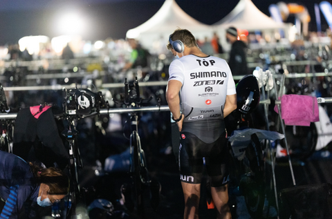 One Team On Pace member stands with his water bottle 