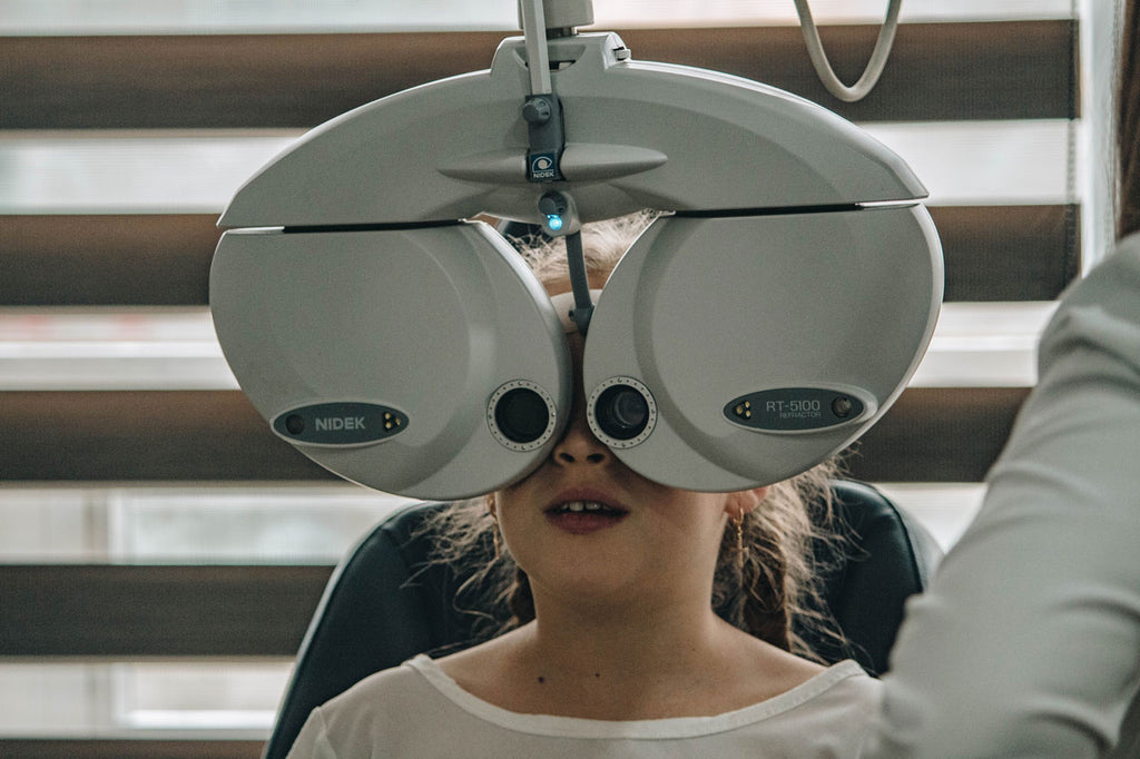 Child at optician having eye test