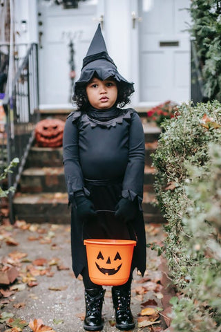 child dressed as a witch for halloween