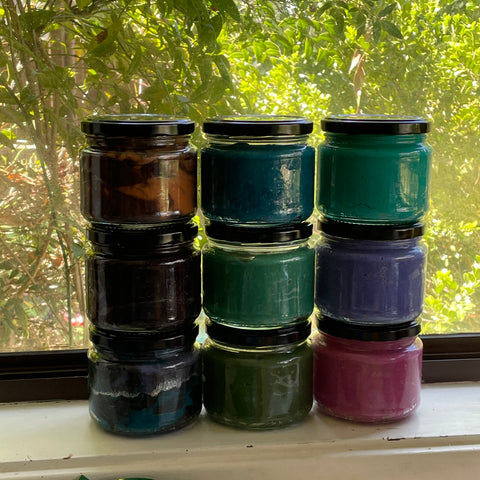 homemade play dough in jars on a window sill 