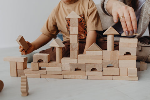 Stage 3 of Block Play children balancing blocks on top of one another