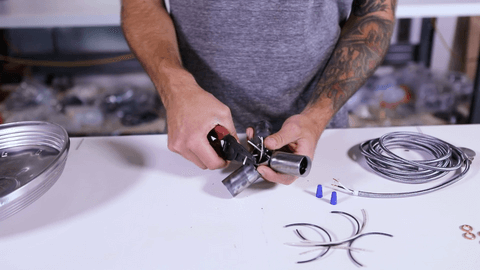 A Man Wiring the Candelabra Trio