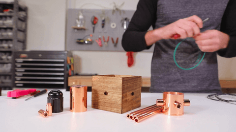 A man doing the wiring to create a custom cluster body