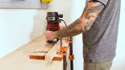 A man prepping the wood slab to create a Plug in 4-Arm Wall Sconce