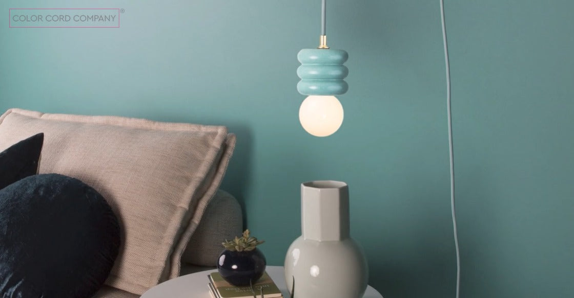 reading nook with a blue clay pot light fixture