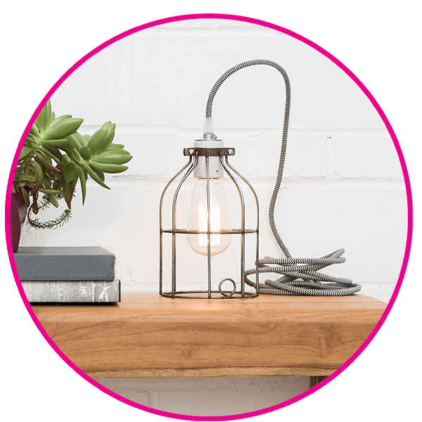 Color Cord cage light fixture on an sideboard table