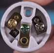  image of 3 different screws in porcelain socket
