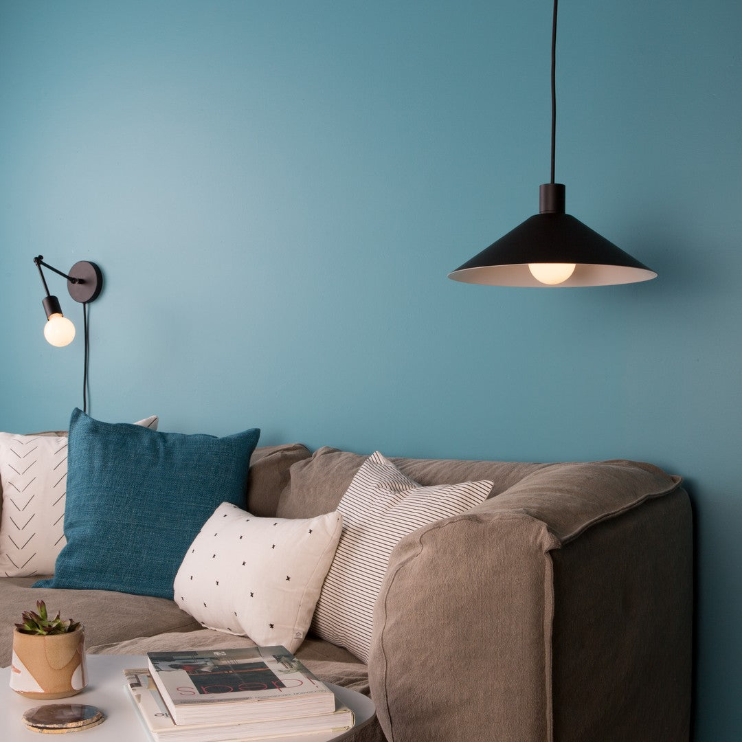 Reading Nook with a Sofa and a Color Cord Pendant Light and Wall Sconce