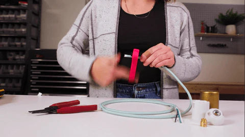 woman stripping wire