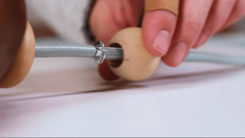 threading beads on electrical cord
